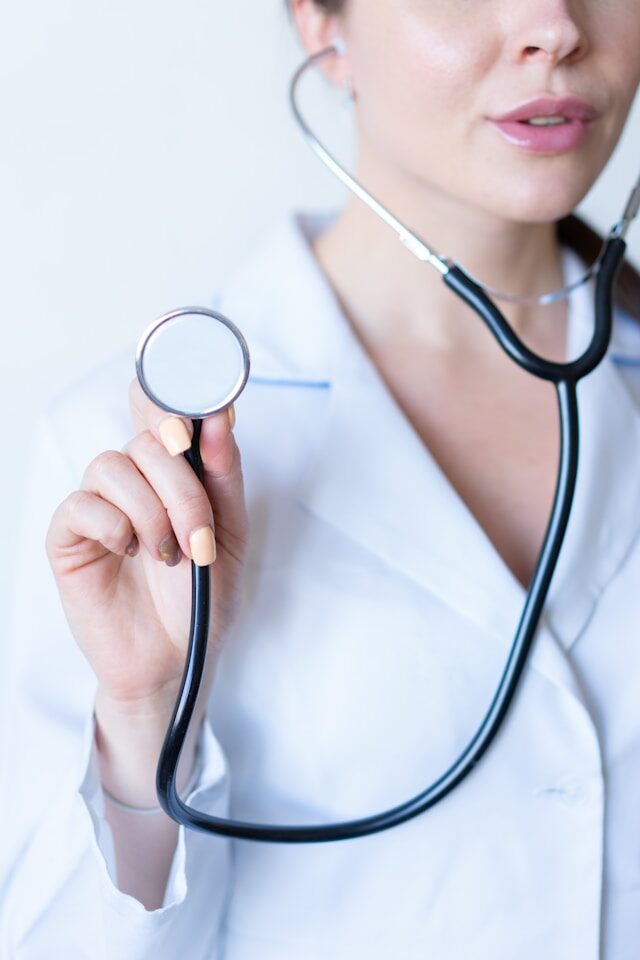 female nurse holding a stethoscope